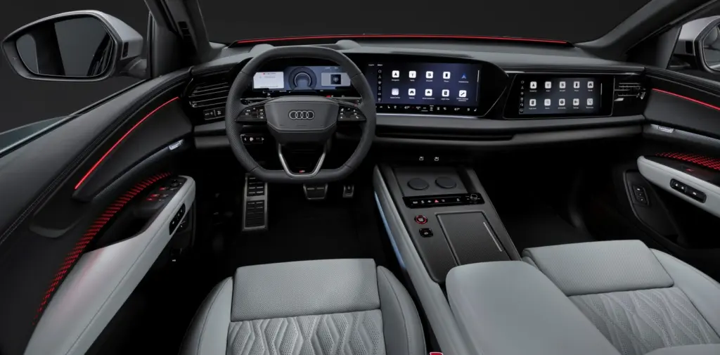 Widok na panoramiczne ekrany systemu MMI i konsolę środkową w nowym Audi Q9 2026.