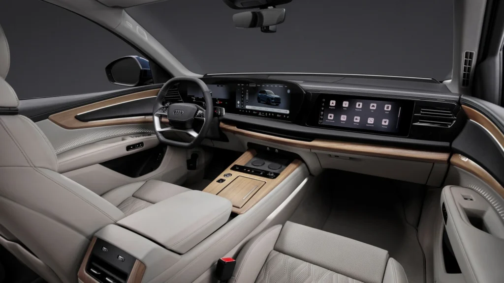 Kokpit nowego Audi Q7 2026 z ekranami MMI i ekranem pasażera