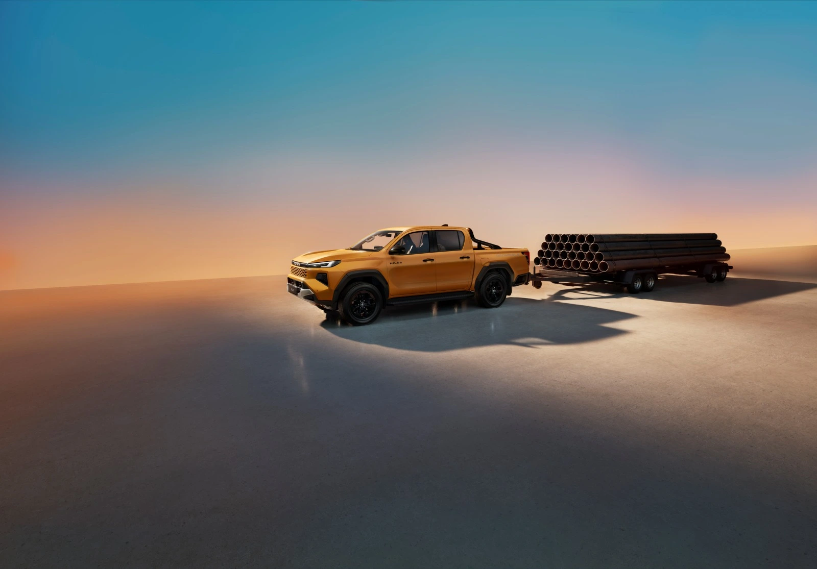 Toyota Hilux 2026 holująca przyczepę z ładunkiem