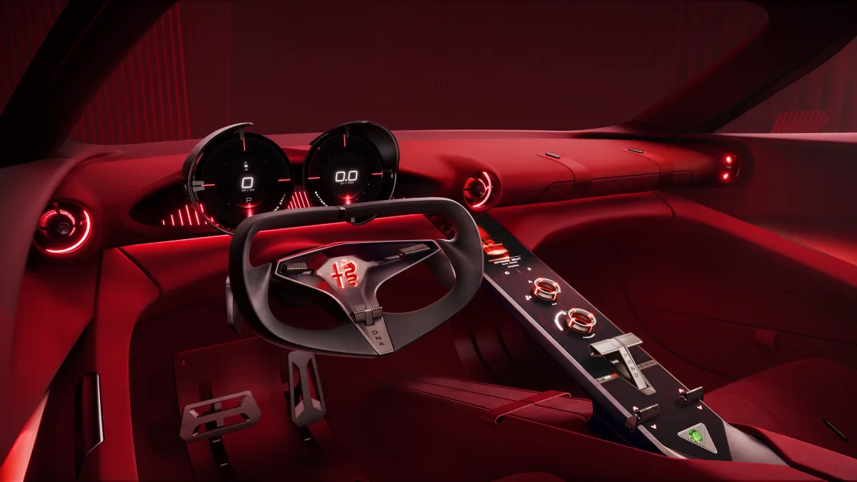 Kokpit Alfa Romeo Cuorerosso z futurystyczną kierownicą, dwoma okrągłymi wskaźnikami i czerwonym podświetleniem