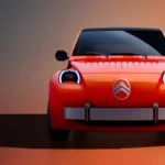 Pomarańczowy Citroën 2 CV Concept widziany od przodu, z okrągłymi reflektorami LED i charakterystycznym logo marki