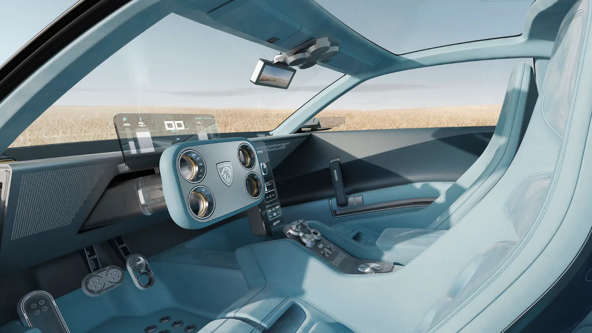 Wnętrze Peugeot RCZ Vision z jasnoniebieskimi fotelami, kierownicą Hypersquare i przezroczystym cyfrowym wyświetlaczem